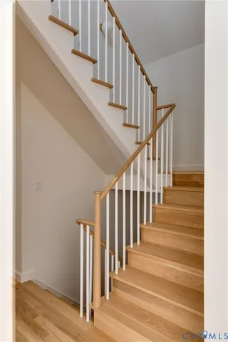 a living room with furniture and a mirror
