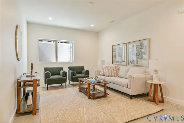 a living room with furniture and window