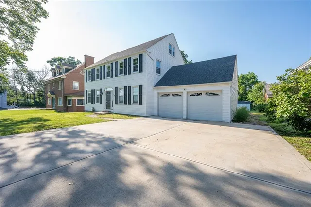 a house with swimming pool in front of it