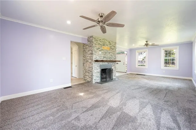 a view of an empty room with a fireplace