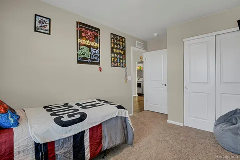 a bedroom with a bed and a cabinets