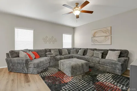 a living room with couches and a coffee table