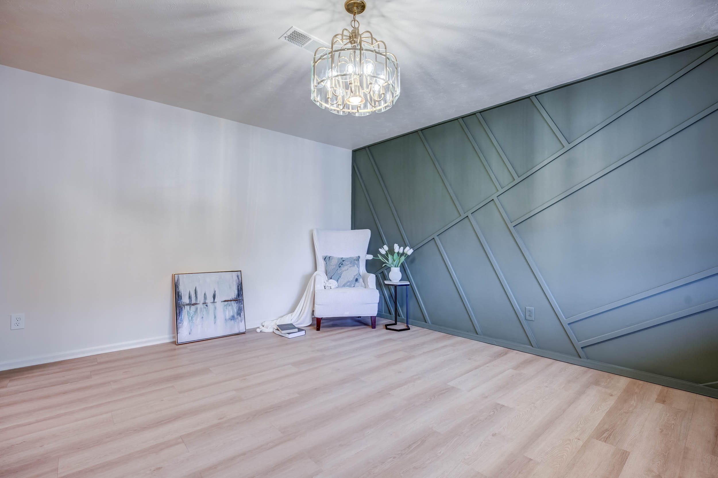 2101 64th Street Lubbock, TX 79412 - Photo 10 of 30 a bedroom with a bed and a chandelier