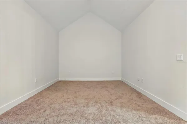 an empty room with a bench