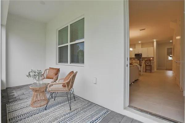 a view of a livingroom with furniture and a window
