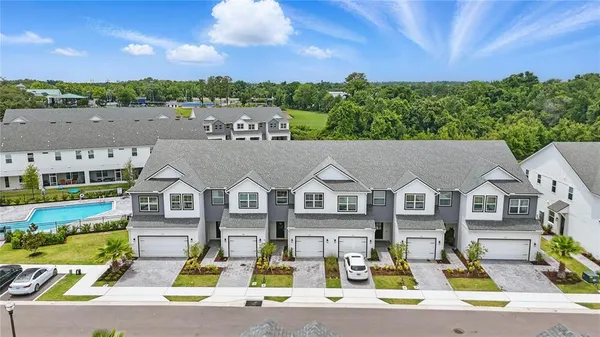 a view of multiple houses with a city street