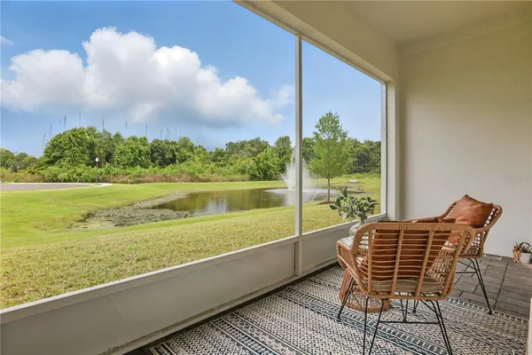 a view of a chair and table in the balcony