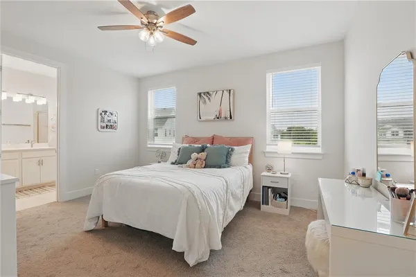 a bedroom with a bed and a couch