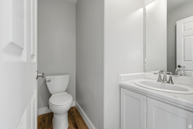 977 East 100 South Payson, UT 84651 - Photo 10 of 19 Half bathroom with vanity and dark wood-style flooring