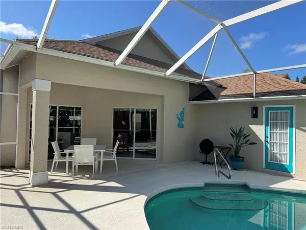a view of a chairs and table in the patio
