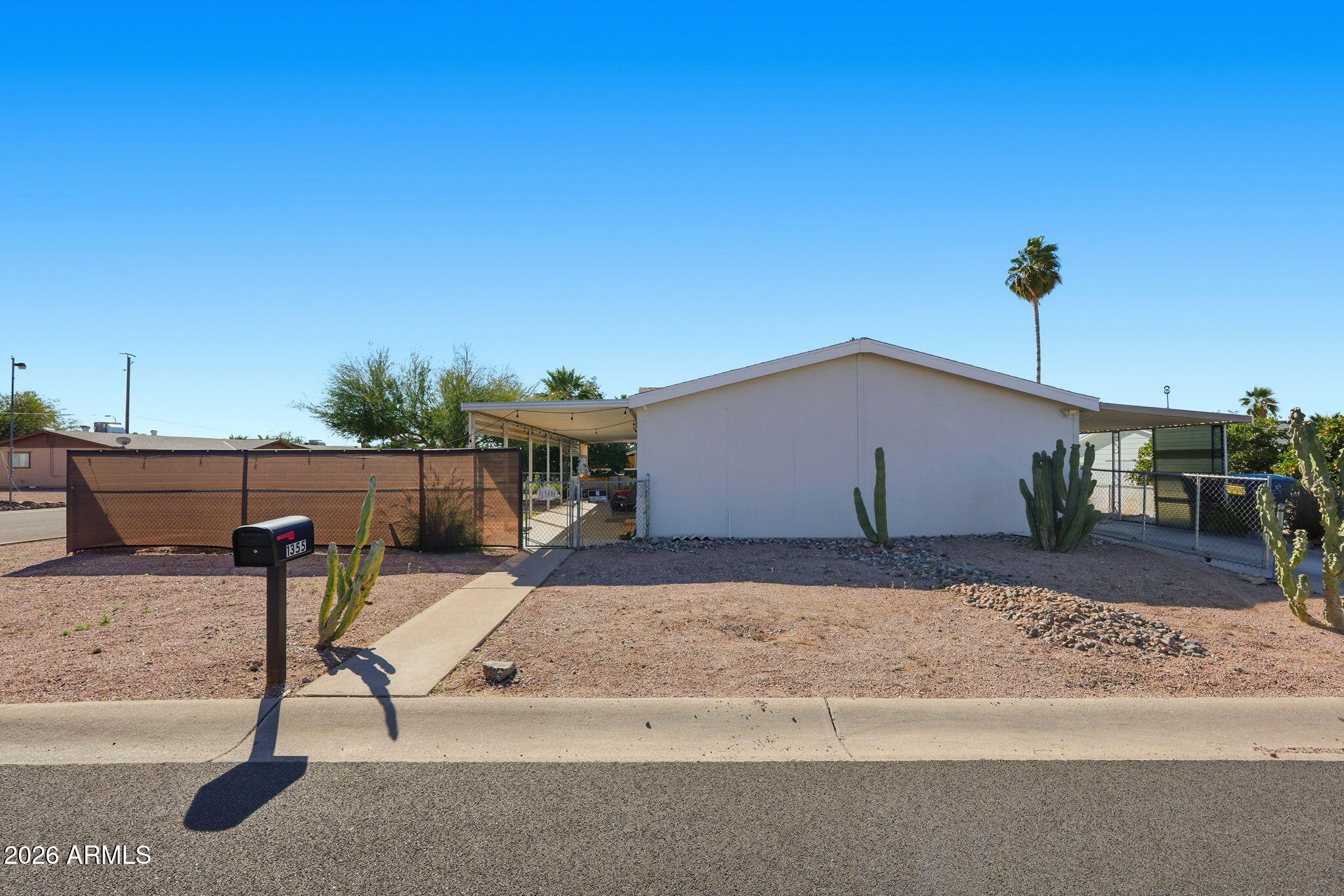 1355 West 4th Avenue Apache Junction, AZ 85120 - Photo 1 of 26 a view of a house with a patio