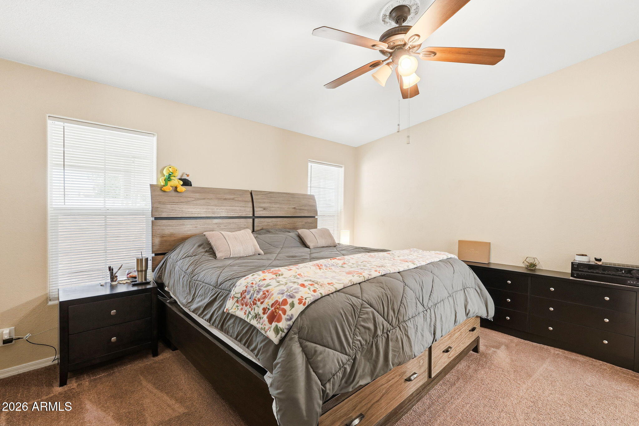 1355 West 4th Avenue Apache Junction, AZ 85120 - Photo 14 of 26 a bedroom with a bed and a window
