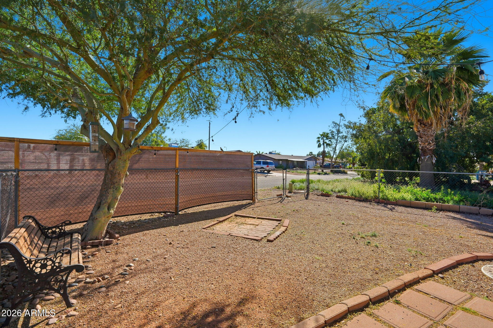 1355 West 4th Avenue Apache Junction, AZ 85120 - Photo 22 of 26 a view of backyard with wooden fence