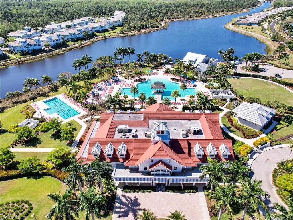 8850 Calypso Court Naples, FL 34113 - Photo 42 of 49 an aerial view of a house with a lake view