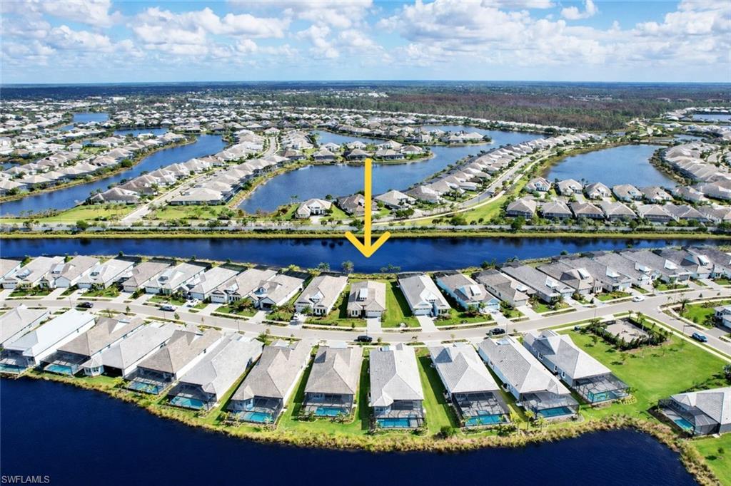 8850 Calypso Court Naples, FL 34113 - Photo 45 of 49 an aerial view of residential houses with outdoor space