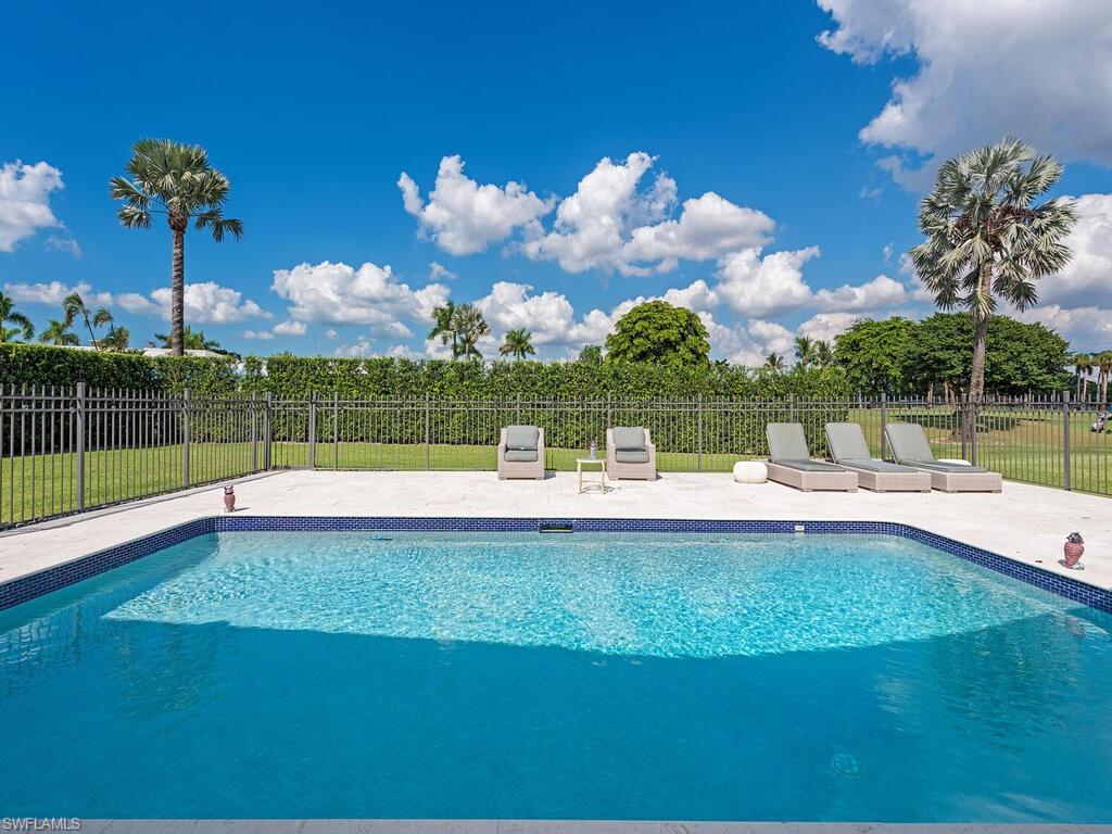 595 Wedge Drive Naples, FL 34103 - Photo 17 of 17 a view of a house with a yard