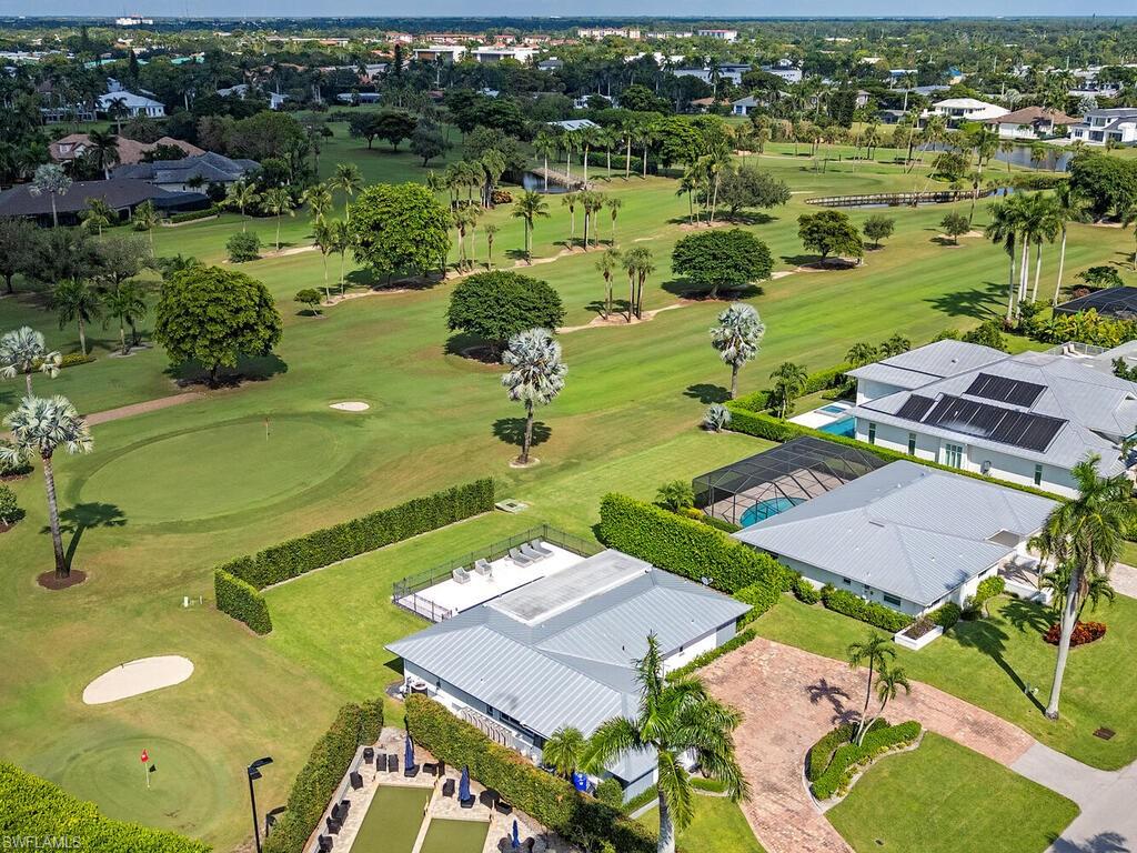 595 Wedge Drive Naples, FL 34103 - Photo 3 of 17 an aerial view of a house a yard basket ball court and outdoor seating