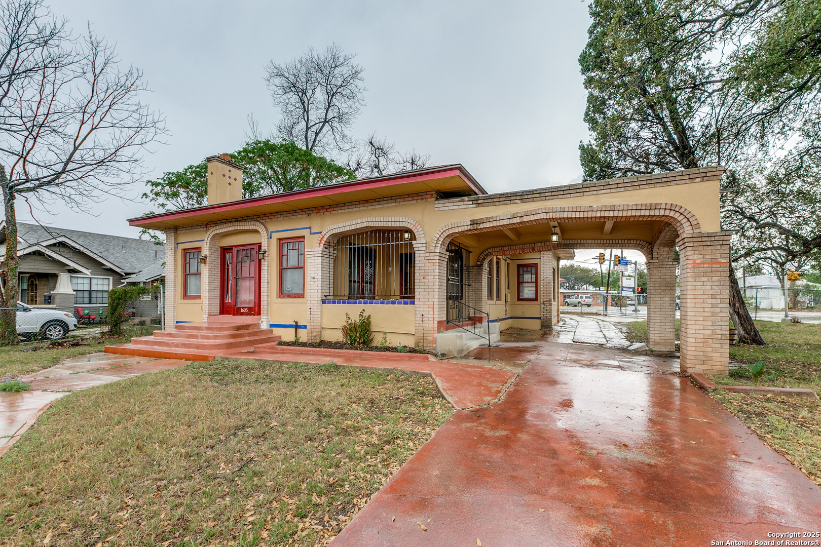 a front view of a house with yard patio and outdoor seating