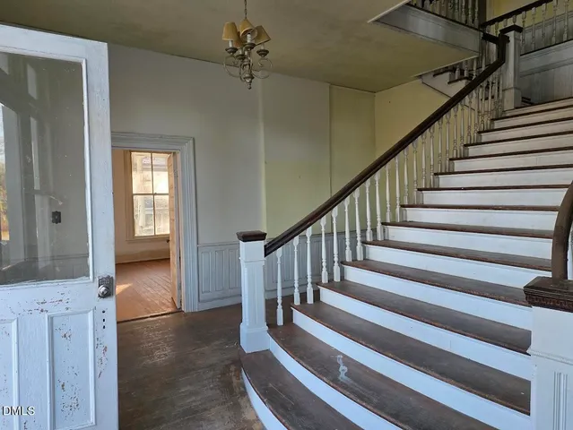 a view of entryway with wooden floor