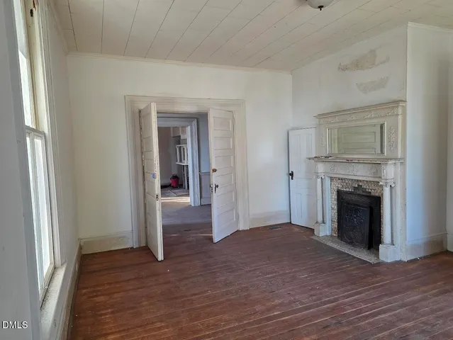 a room with furniture and a fireplace