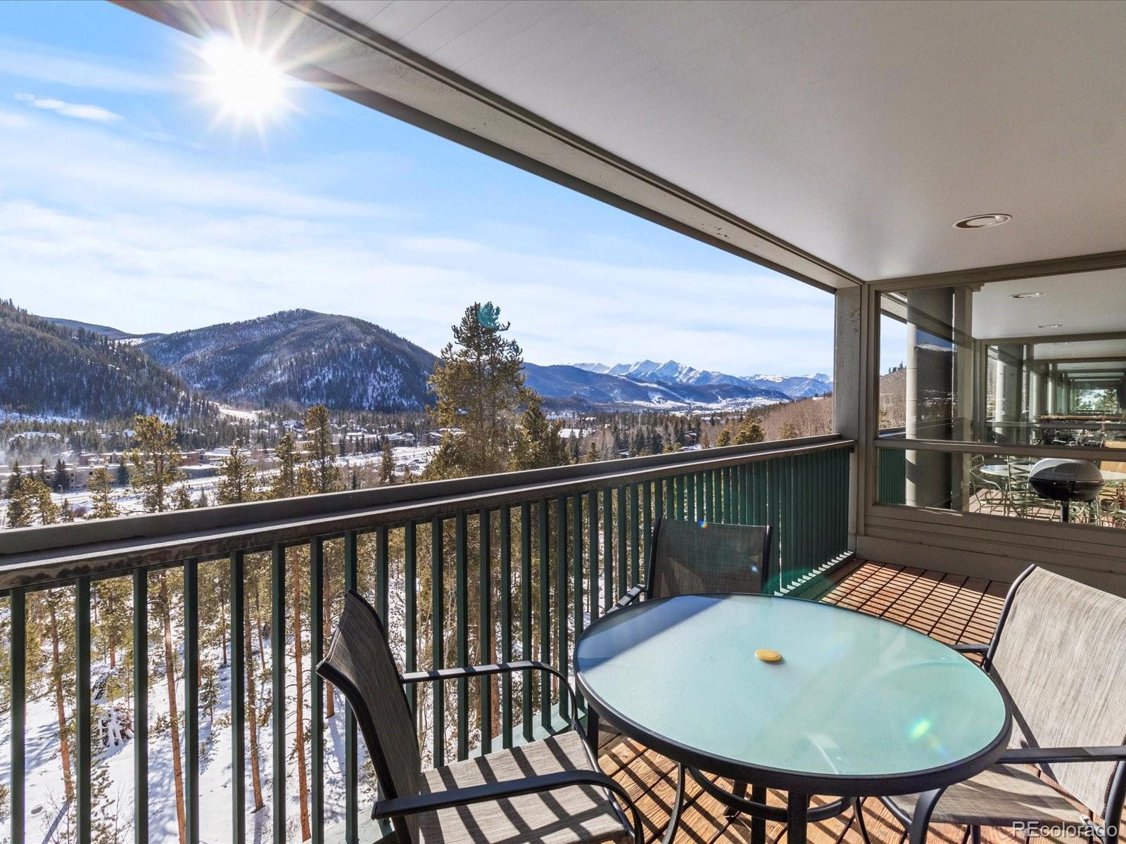 22097 Saints John Road, Unit 2540 Dillon, CO 80435 - Photo 20 of 28 a view of a balcony with a table and chairs
