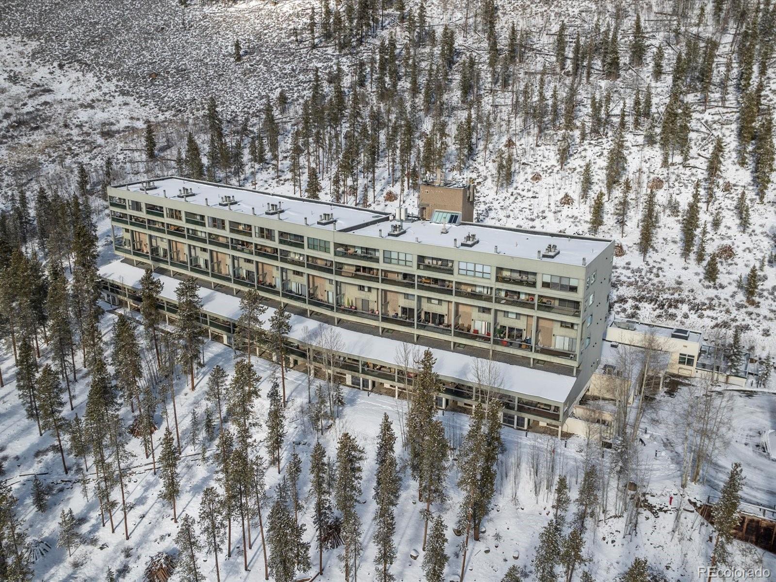 22097 Saints John Road, Unit 2540 Dillon, CO 80435 - Photo 21 of 28 a view of a large building with a bench
