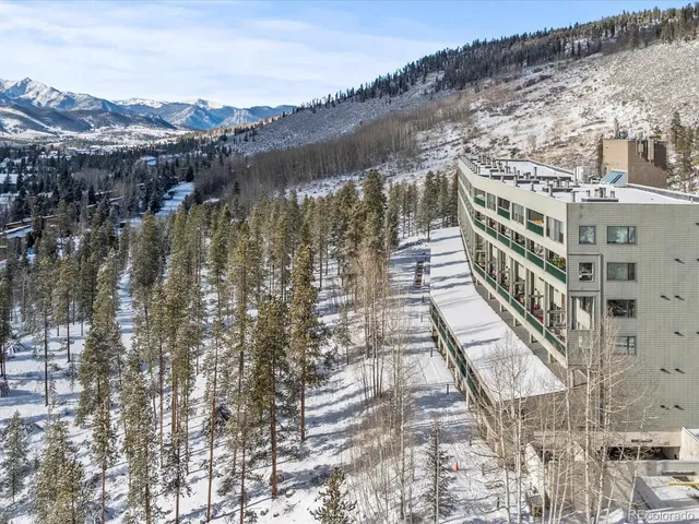 a large building sitting on top of a lake
