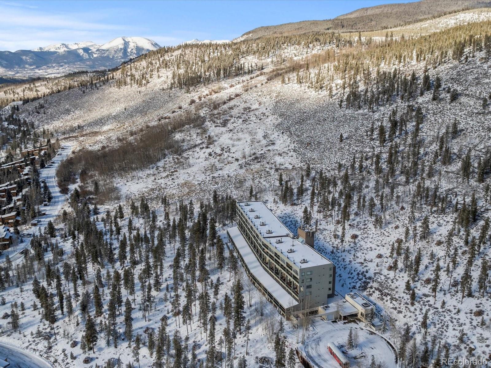 22097 Saints John Road, Unit 2540 Dillon, CO 80435 - Photo 25 of 28 a view of a building with mountains in the background