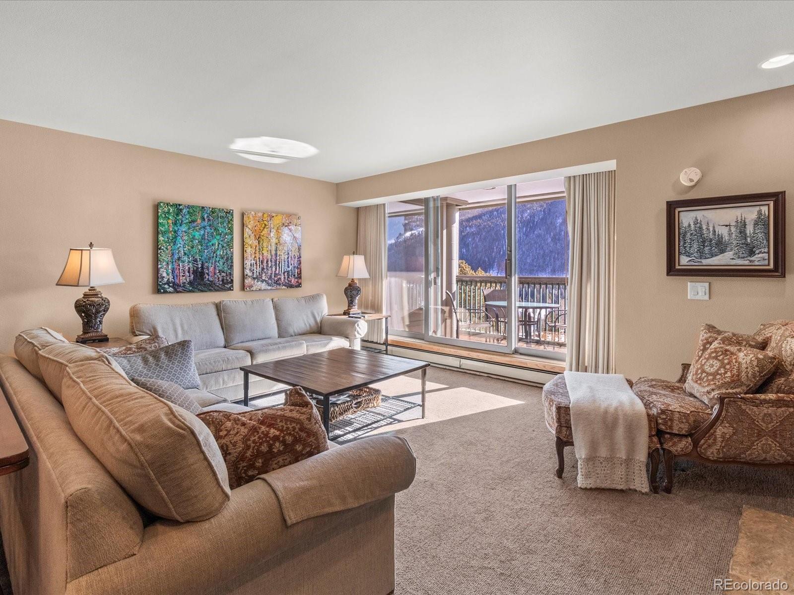 22097 Saints John Road, Unit 2540 Dillon, CO 80435 - Photo 3 of 28 a living room with furniture and a large window