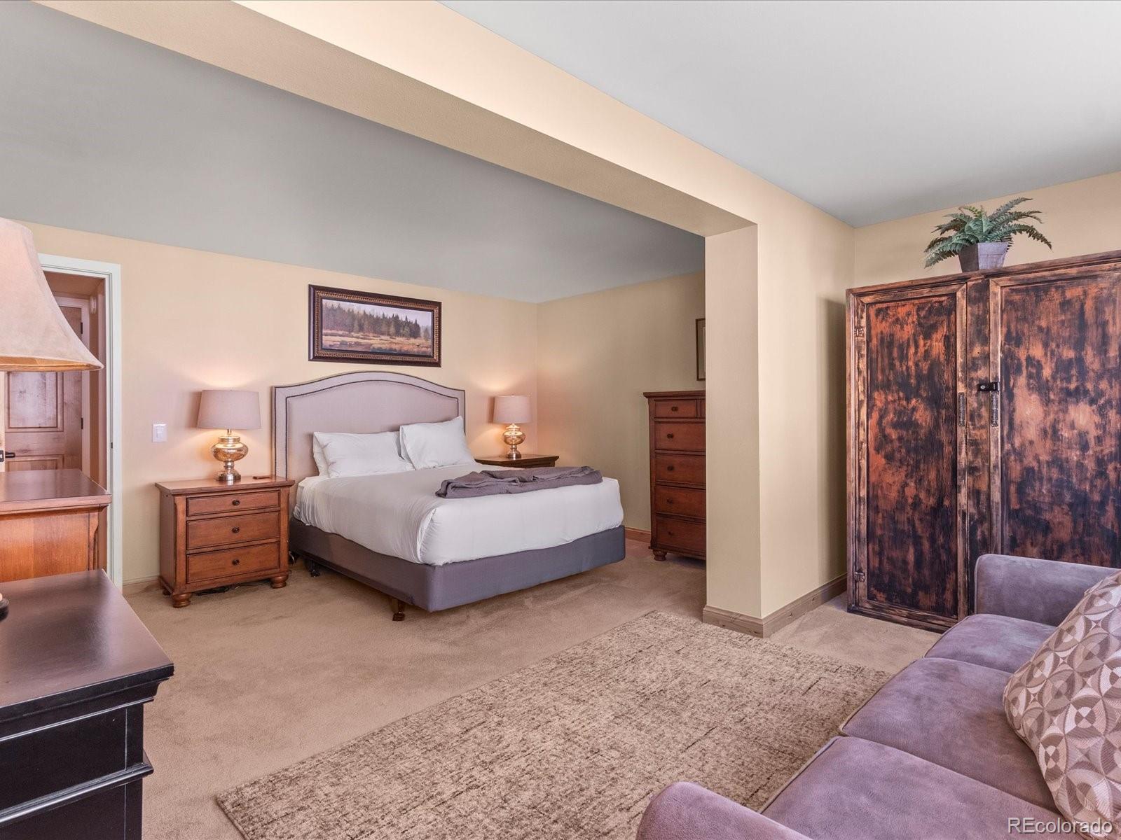 22097 Saints John Road, Unit 2540 Dillon, CO 80435 - Photo 10 of 28 a bedroom with a bed and a couch