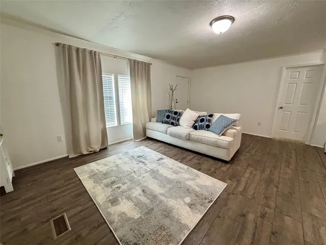 a kitchen that has a sink and a stove in it