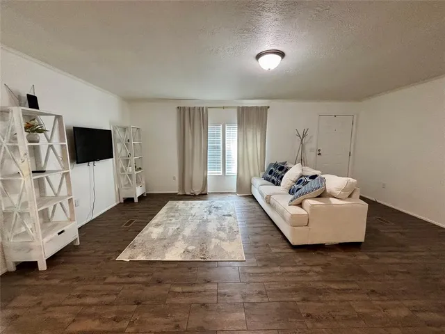 a kitchen with granite countertop stainless steel appliances and wooden cabinets