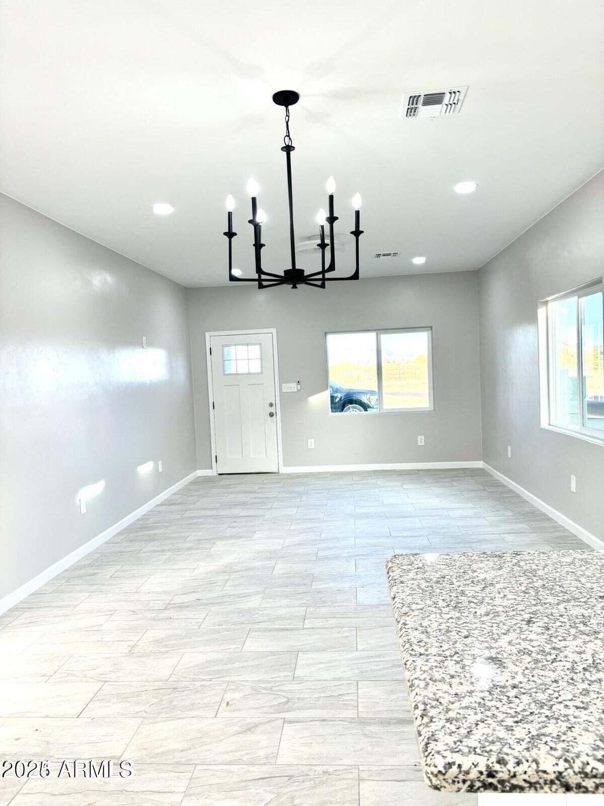 3440 Camino Del Rancho Douglas, AZ 85607 - Photo 7 of 17 a view of a room with window and wooden floor