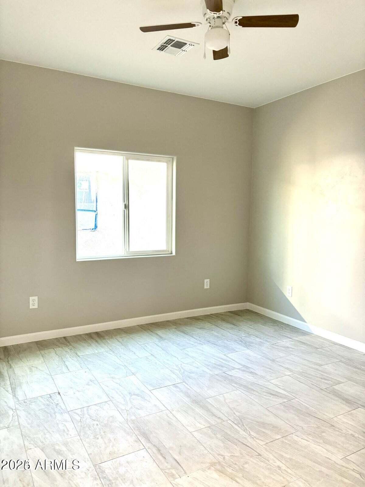3440 Camino Del Rancho Douglas, AZ 85607 - Photo 9 of 17 an empty room with a window