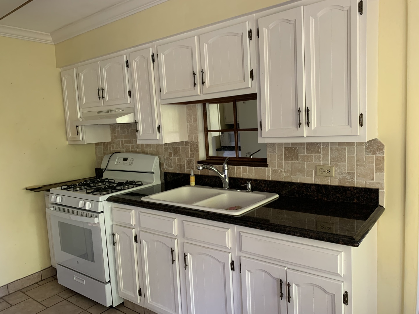 501 Crestview Drive Fox River Grove, IL 60021 - Photo 13 of 23 a kitchen with granite countertop white cabinets and a stove