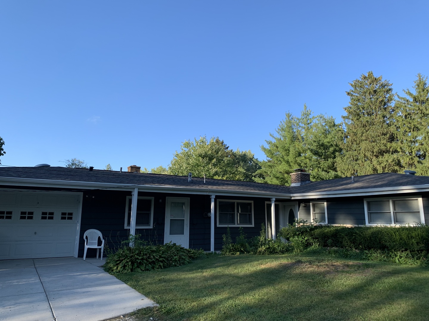 501 Crestview Drive Fox River Grove, IL 60021 - Photo 2 of 23 a view of a yard in front of a house with plants and large tree