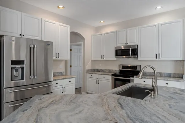 a view of a kitchen with marble kitchen and sink