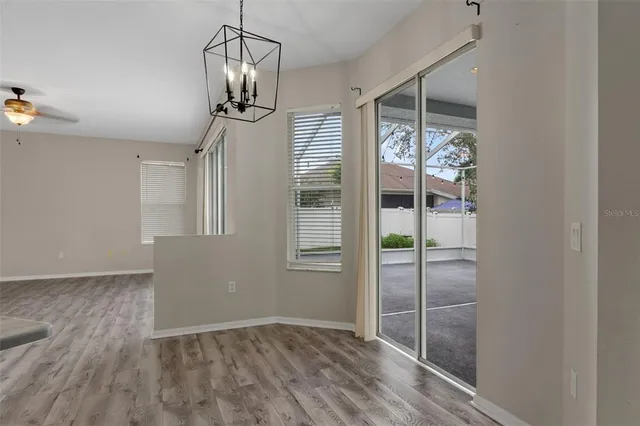 a bathroom with a granite countertop sink mirror and bathtub