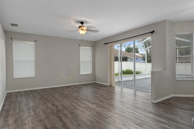 a bathroom with a tub a window and a shower