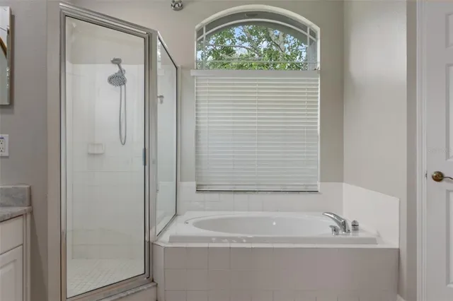 a bathroom with a granite countertop toilet and a mirror