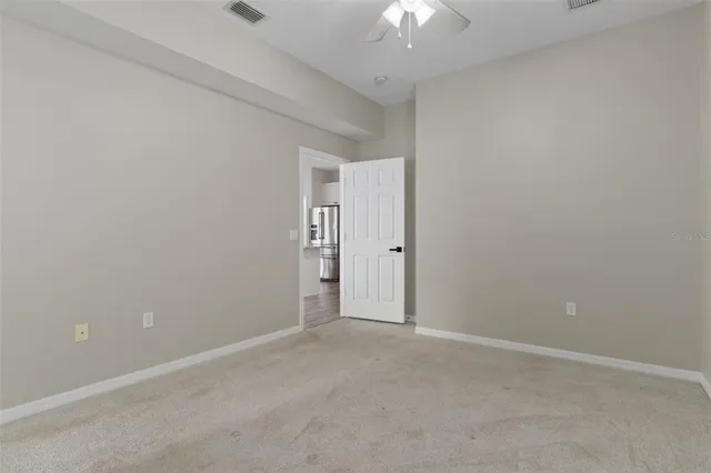 a view of a building with a floor to ceiling window and door