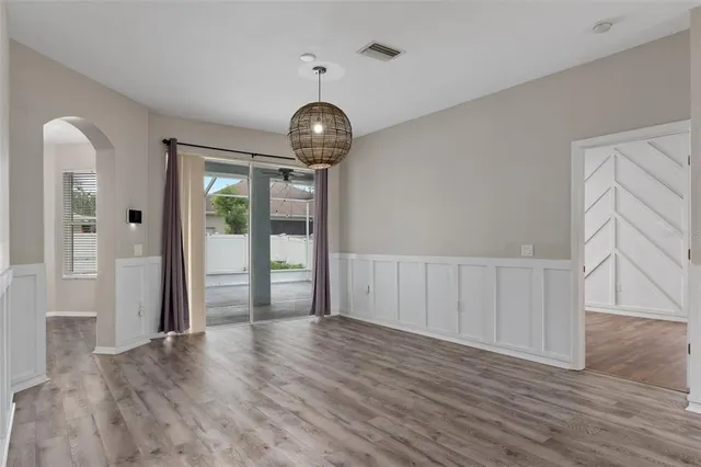 a kitchen with stainless steel appliances granite countertop a refrigerator a stove a sink and a granite counter tops