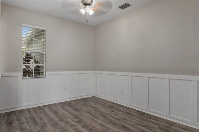 a kitchen with stainless steel appliances kitchen island granite countertop a refrigerator and cabinets