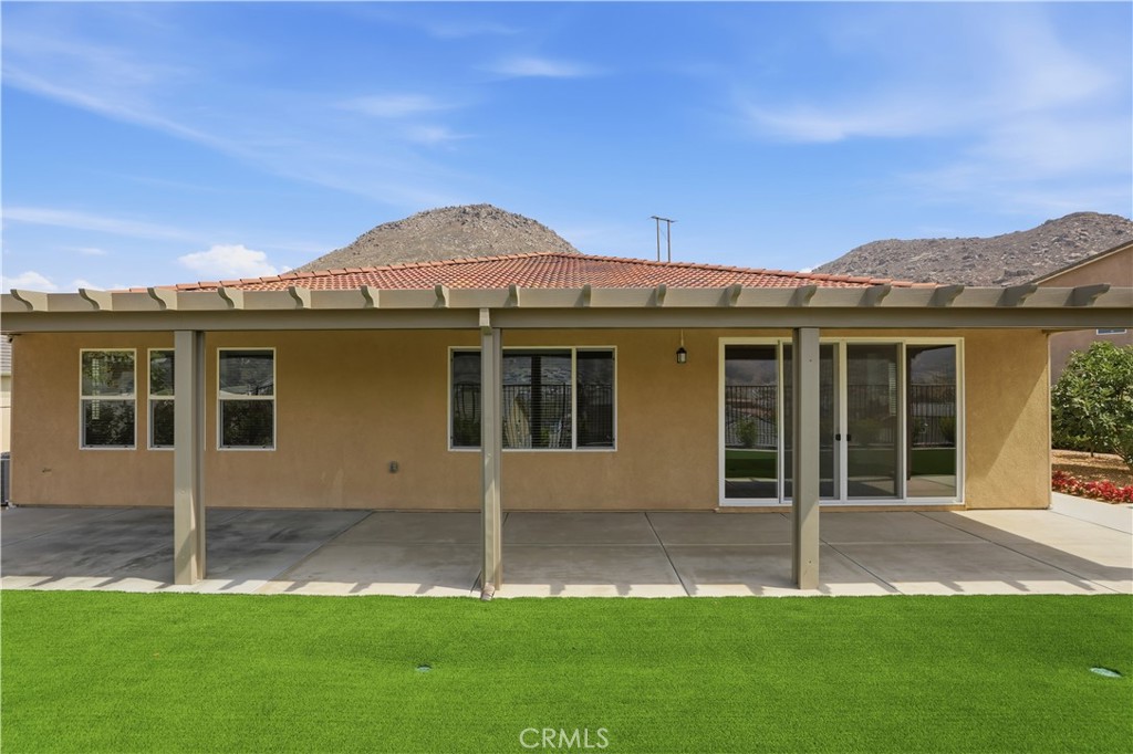 21159 Blue Jeans Court Riverside, CA 92507 - Photo 51 of 63 a view of a house with a yard