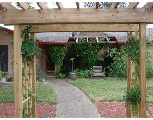 206 Seco Drive Portland, TX 78374 - Photo 2 of 10 a view of a backyard with a garden