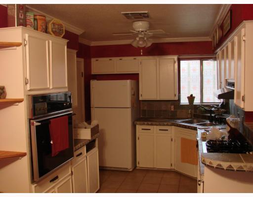 206 Seco Drive Portland, TX 78374 - Photo 6 of 10 a kitchen with a sink stove and refrigerator