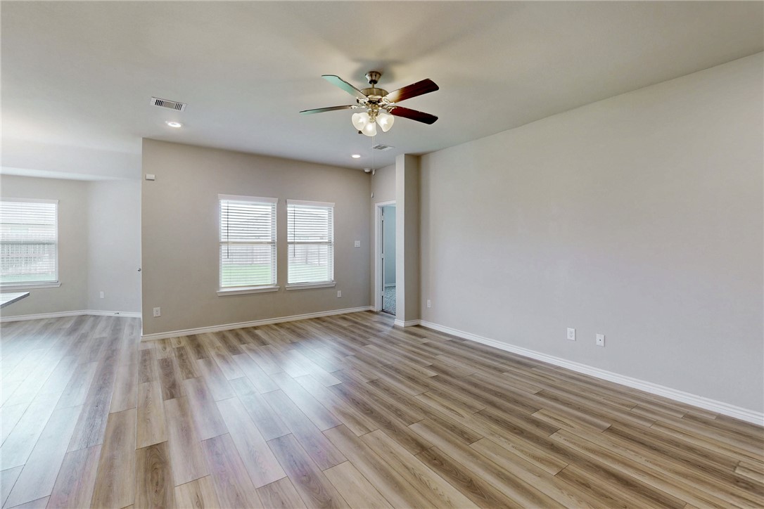 2010 Chief Street Bryan, TX 77807 - Photo 13 of 29 a view of an empty room with wooden floor and a window