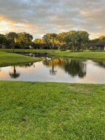 10110 Cedar Point Boulevard, Unit 203 Boynton Beach, FL 33437 - Photo 17 of 37 a view of a lake