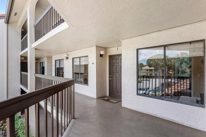 10110 Cedar Point Boulevard, Unit 203 Boynton Beach, FL 33437 - Photo 2 of 37 a view of staircase with large windows