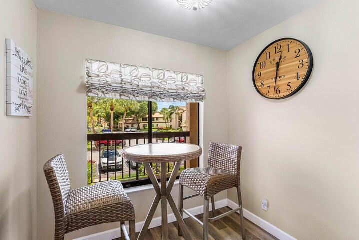 10110 Cedar Point Boulevard, Unit 203 Boynton Beach, FL 33437 - Photo 7 of 37 a view of a livingroom with furniture and a large window